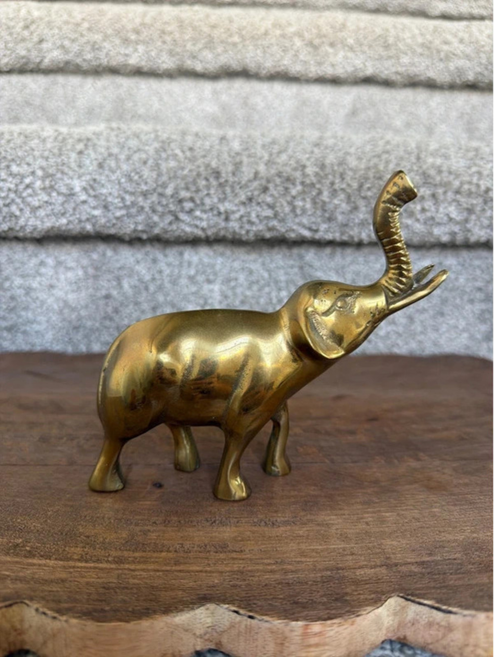 Gold colored elephant figurine.  6” tall.